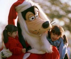 Puzle Goofy vestido como Papai Noel abraçando duas meninas
