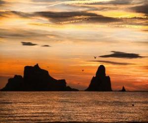 Puzle Pôr do sol sobre o mar com as Ilhas Medes em segundo plano