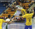 Handebol ou Andebol - Jogador no salto para lançar