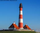 O farol de Westerheversand localizado em Westerhever, estado de Schleswig-Holstein, Alemanha. Um farol mais conhecido no norte da Alemanha, foi construída em 1908