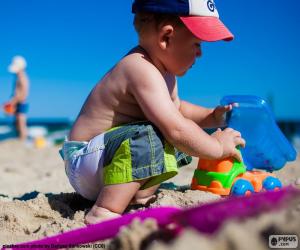 Puzle Uma criança brincando na praia